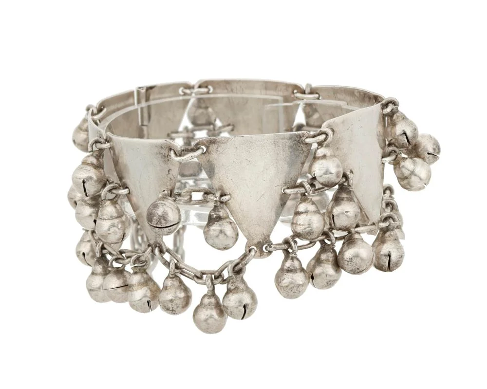 A Héctor Aguilar sterling silver bell bracelet, c.1940-1945. Hand-fabricated 940 silver with rounded bell drops, sold at John Moran Auctioneers in April 2023 for $2,080 against $31 of metal at the day's silver spot.