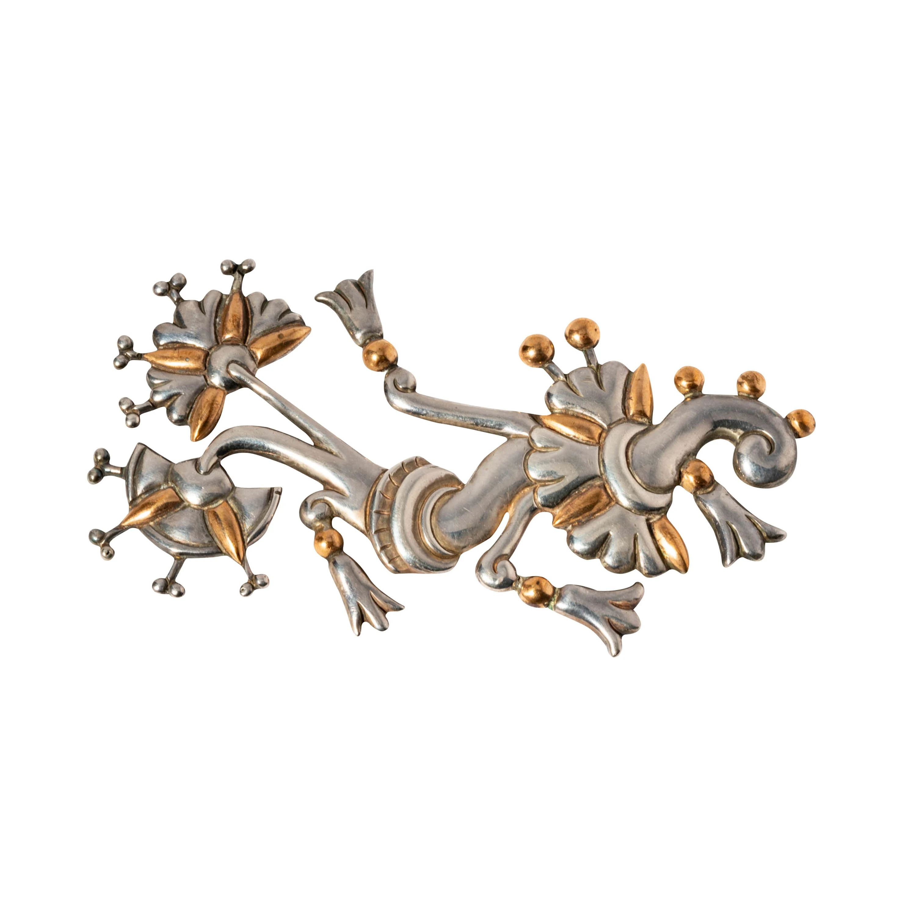 William Spratling's Tree of Life brooch in sterling silver, late 1940s. A symmetrical openwork composition of a stylized tree with branches splayed from a central trunk, hand-fabricated from cut and oxidized 980 silver.