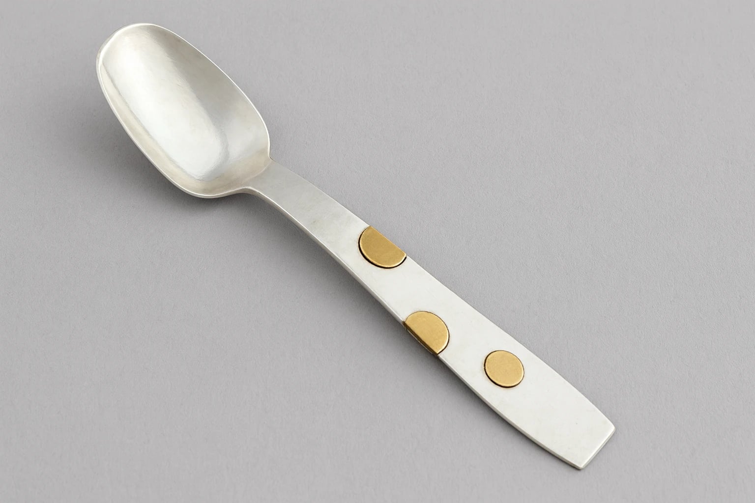 William Spratling Teaspoon with Gold Circular Buttons Applied