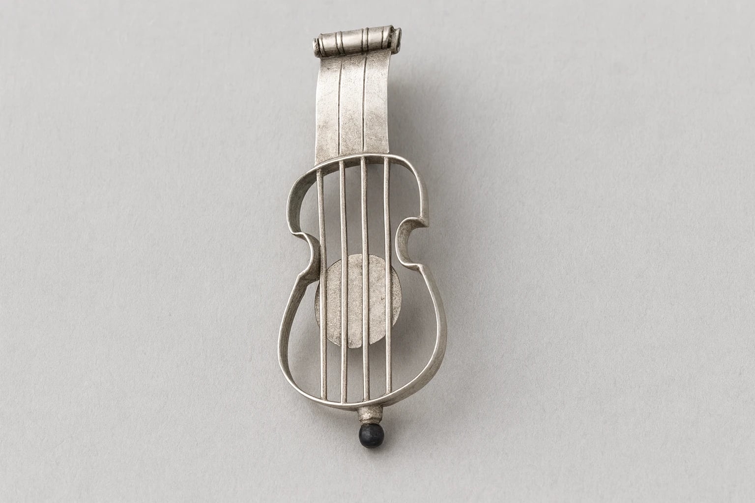 William Spratling Obsidian Brooch of a Guitar
